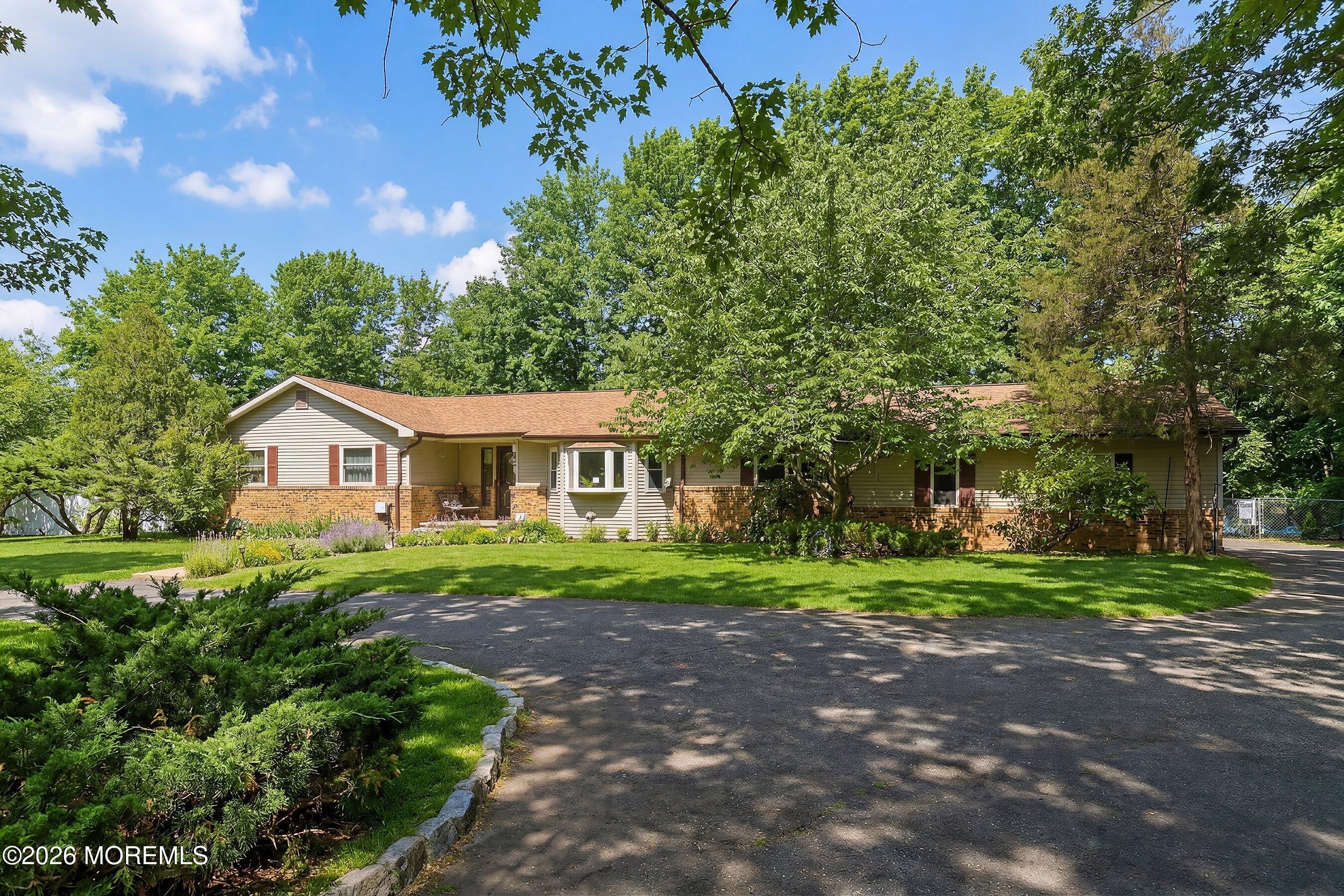 151 North Cooks Bridge Road Jackson, NJ 08527 - Photo 2 of 48 a front view of a house with a yard