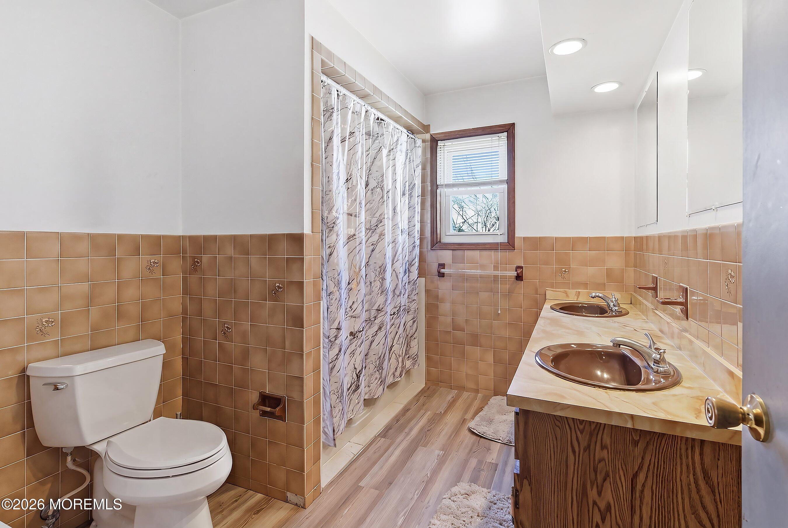 151 North Cooks Bridge Road Jackson, NJ 08527 - Photo 22 of 48 a bathroom with a sink a toilet and shower