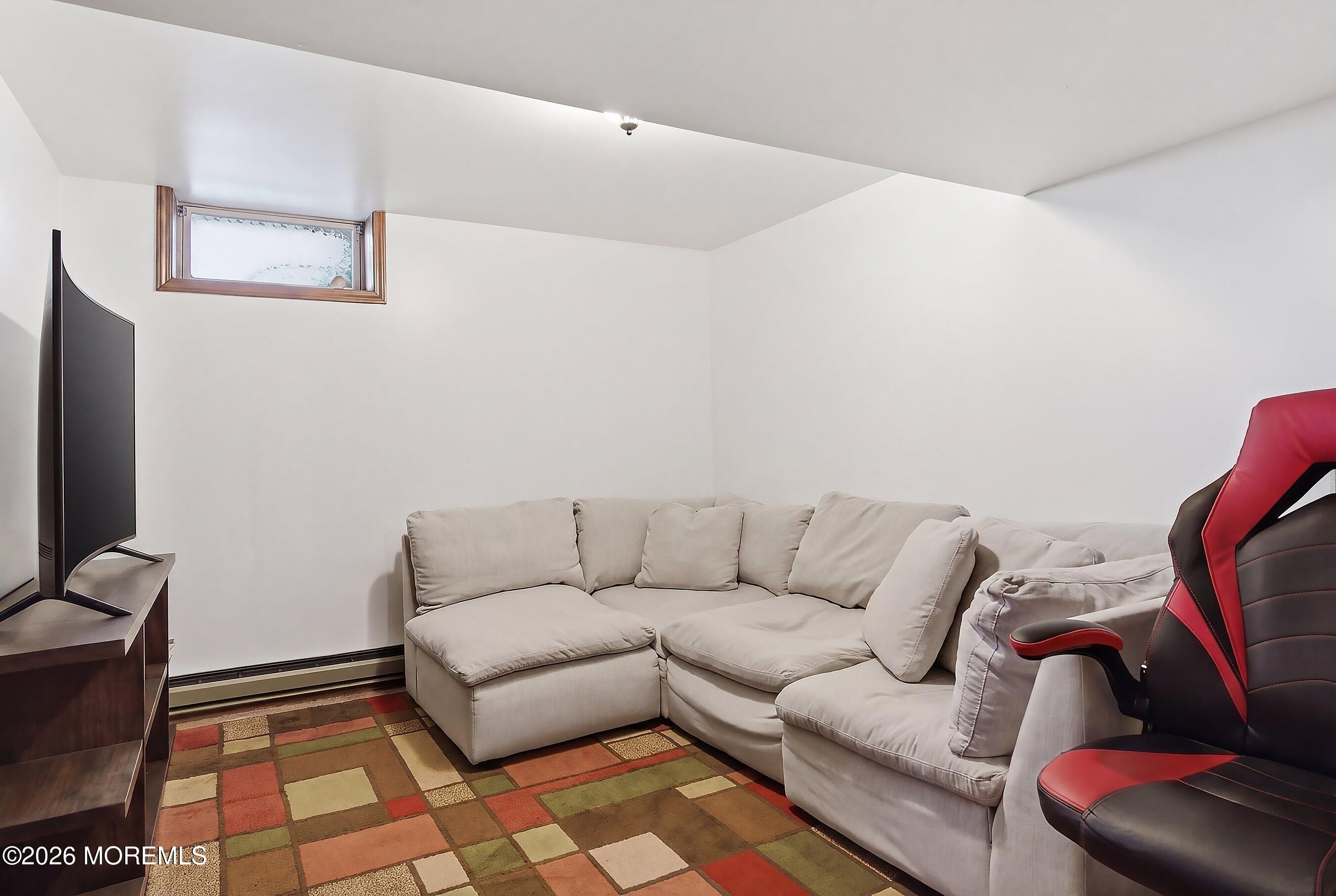 151 North Cooks Bridge Road Jackson, NJ 08527 - Photo 27 of 48 a living room with furniture and a rug