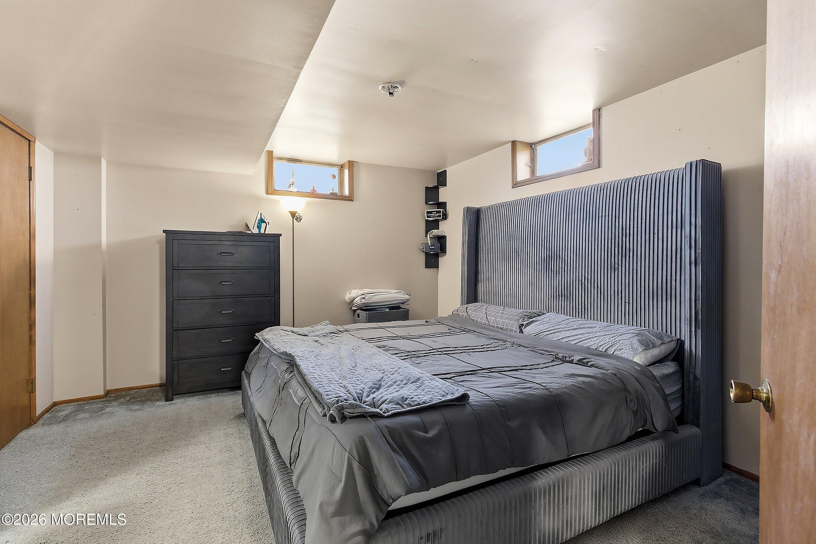 151 North Cooks Bridge Road Jackson, NJ 08527 - Photo 28 of 48 a bedroom with a bed and a dresser