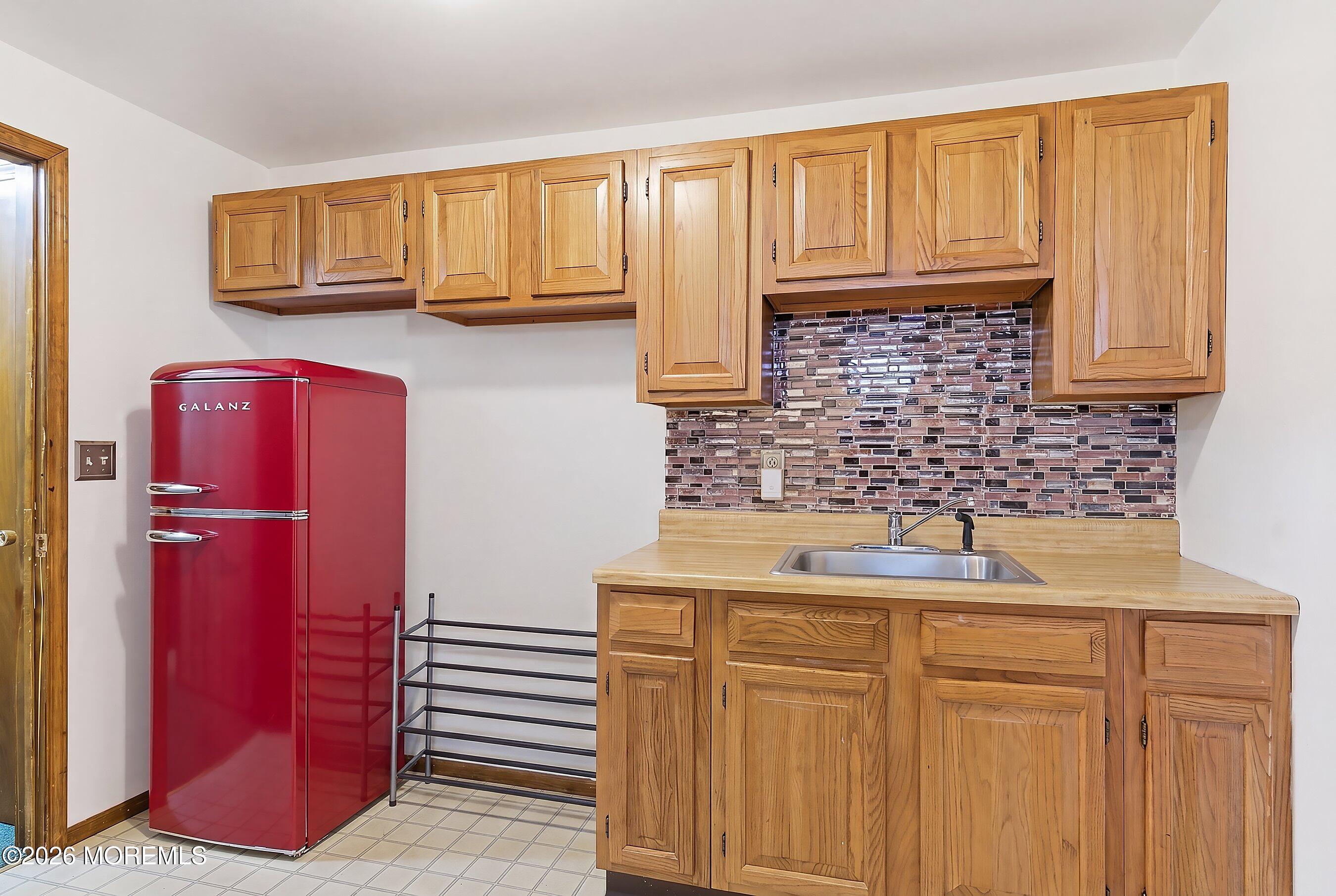 151 North Cooks Bridge Road Jackson, NJ 08527 - Photo 29 of 48 a kitchen with a sink and cabinets