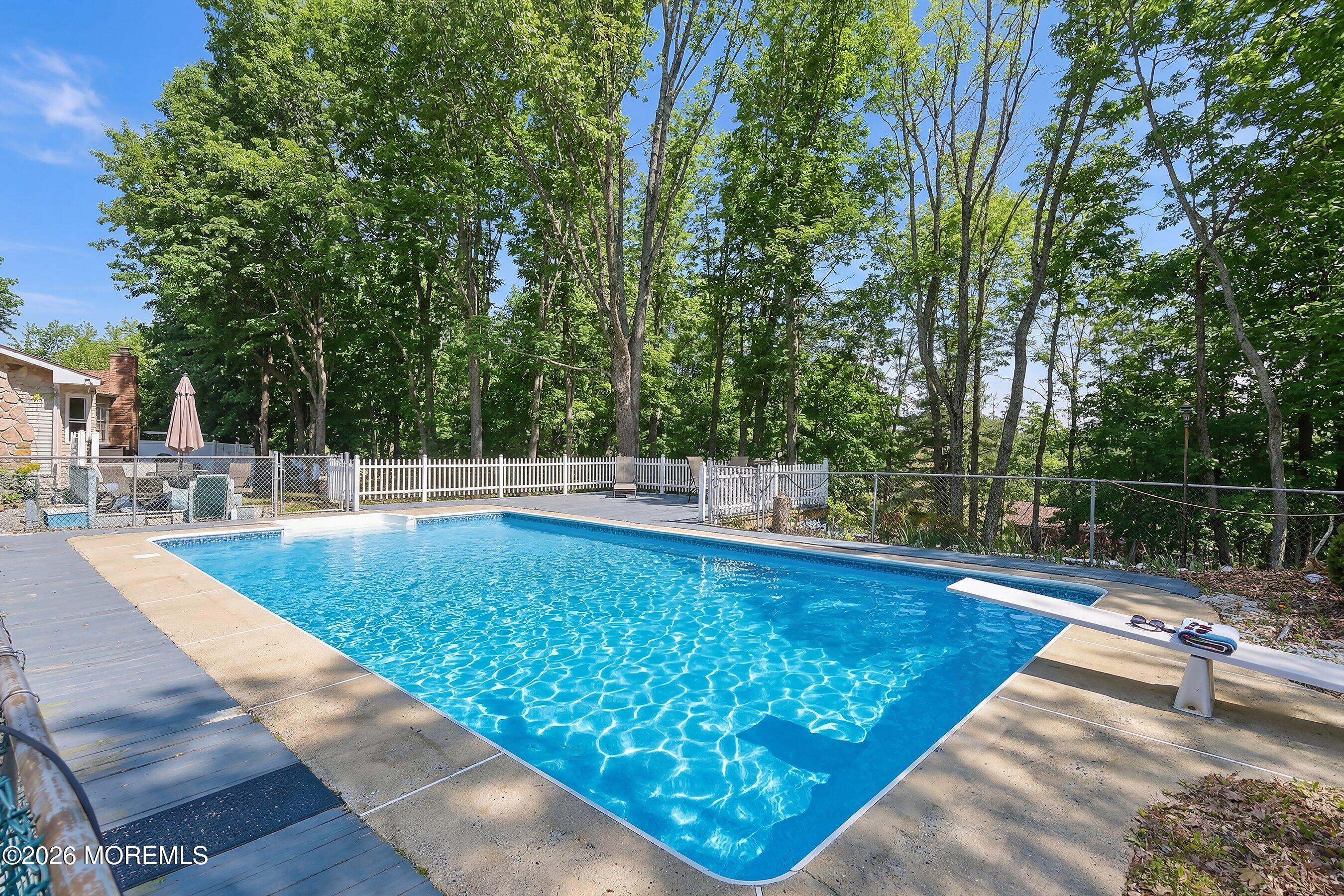 151 North Cooks Bridge Road Jackson, NJ 08527 - Photo 35 of 48 a view of a swimming pool with a patio