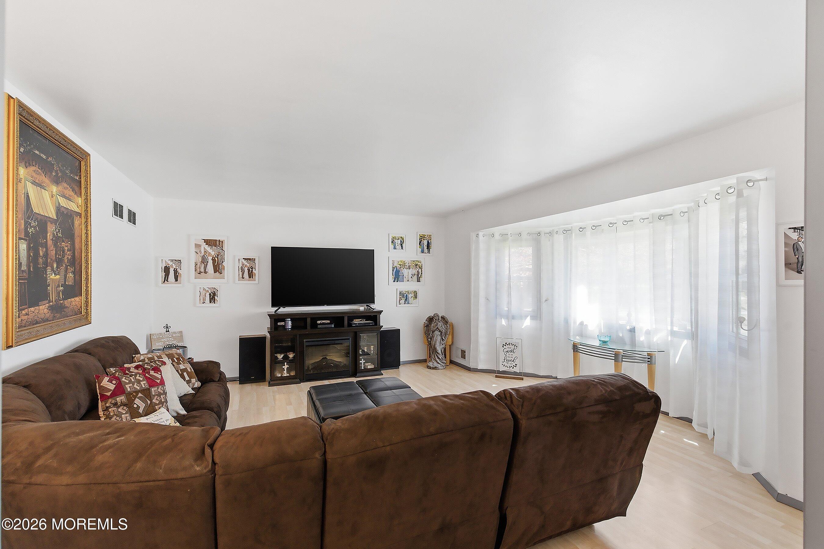 151 North Cooks Bridge Road Jackson, NJ 08527 - Photo 6 of 48 a living room with furniture and a flat screen tv