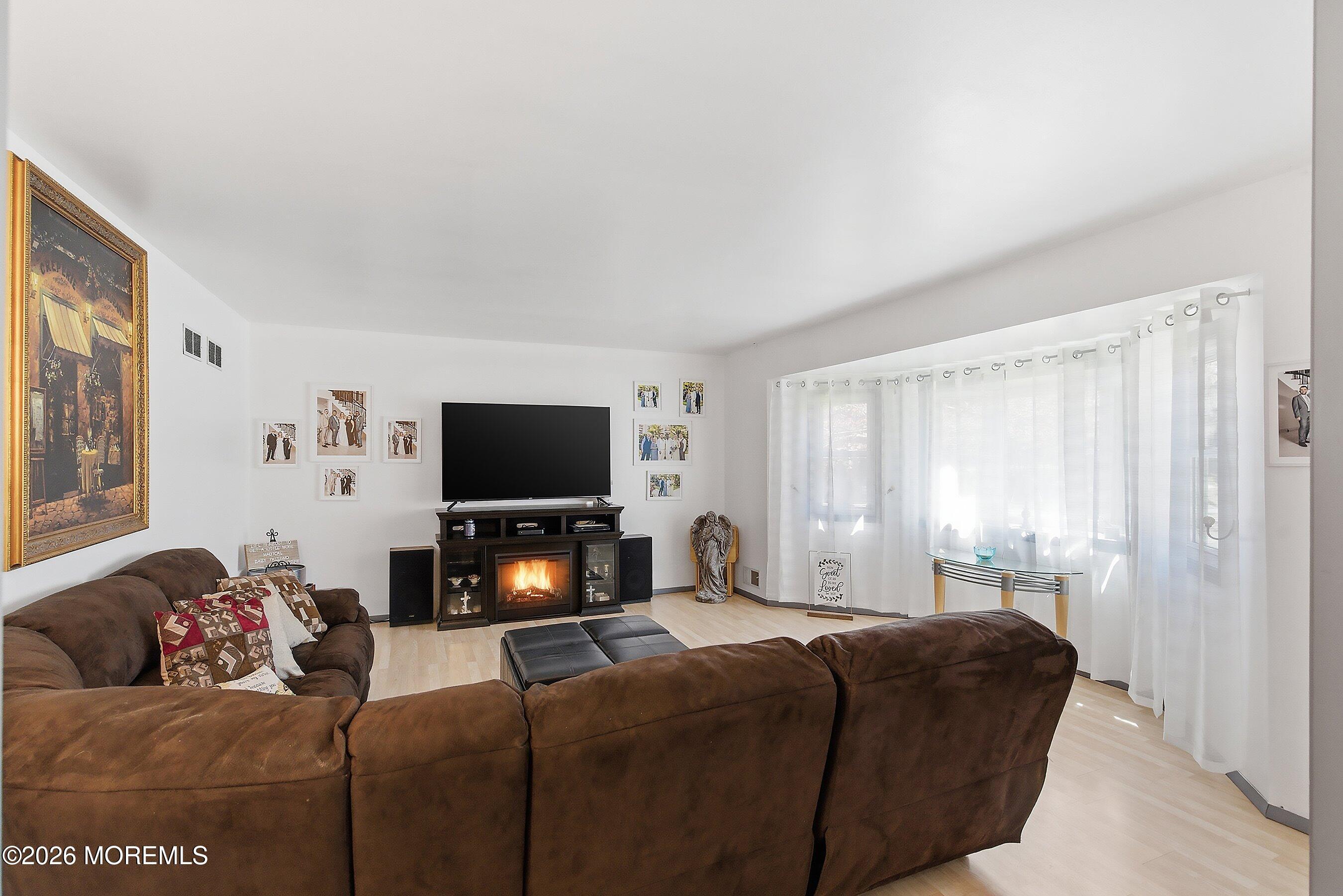 151 North Cooks Bridge Road Jackson, NJ 08527 - Photo 7 of 48 a living room with furniture and a flat screen tv