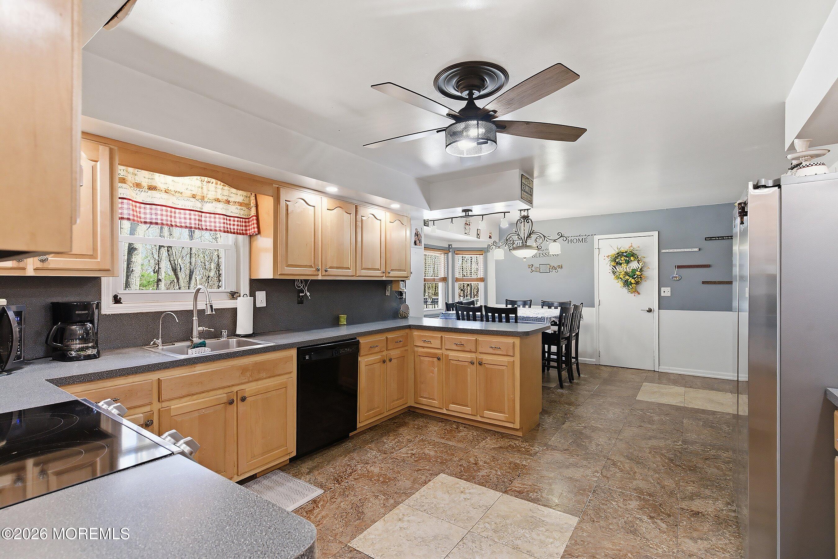 151 North Cooks Bridge Road Jackson, NJ 08527 - Photo 8 of 48 a kitchen with stainless steel appliances granite countertop a sink a stove a refrigerator cabinets and living room view