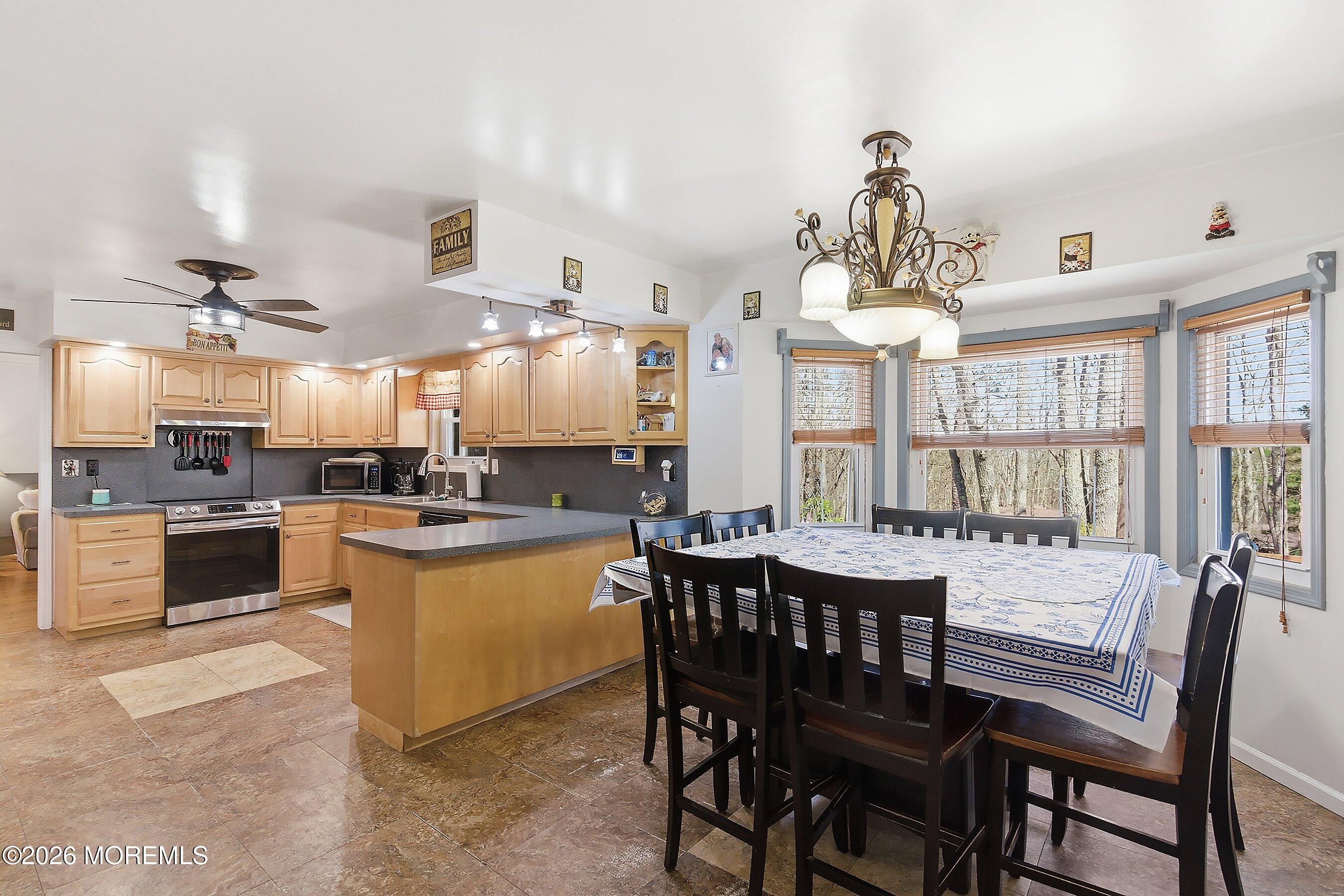 151 North Cooks Bridge Road Jackson, NJ 08527 - Photo 10 of 48 a large kitchen with a table and chairs