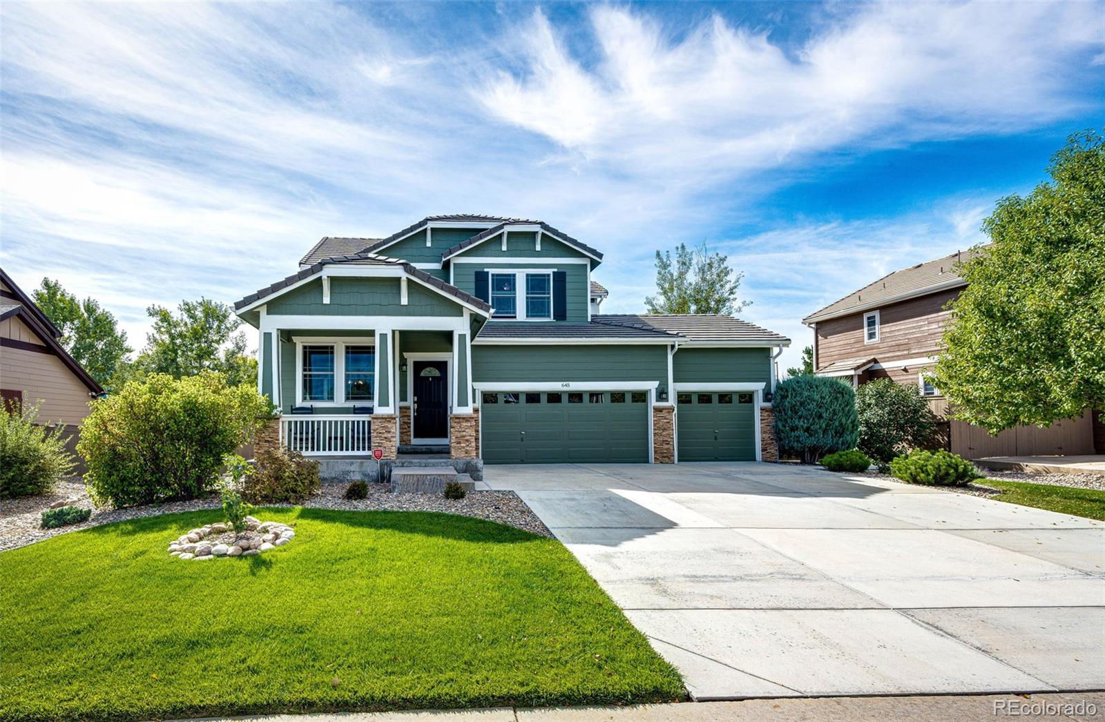 645 Springvale Road Castle Rock, CO 80104 - Photo 1 of 41 a front view of a house with a yard