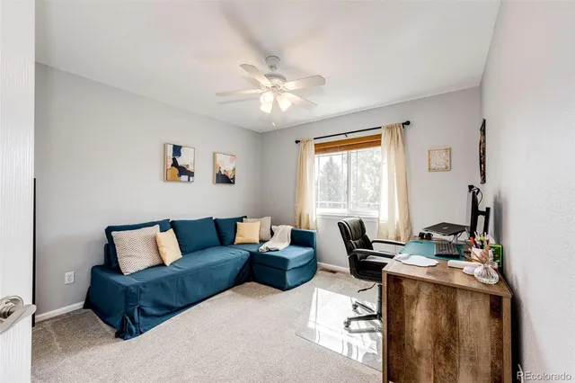 a living room with furniture and a window