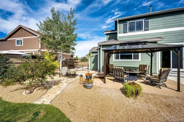 a view of the house with outdoor seating