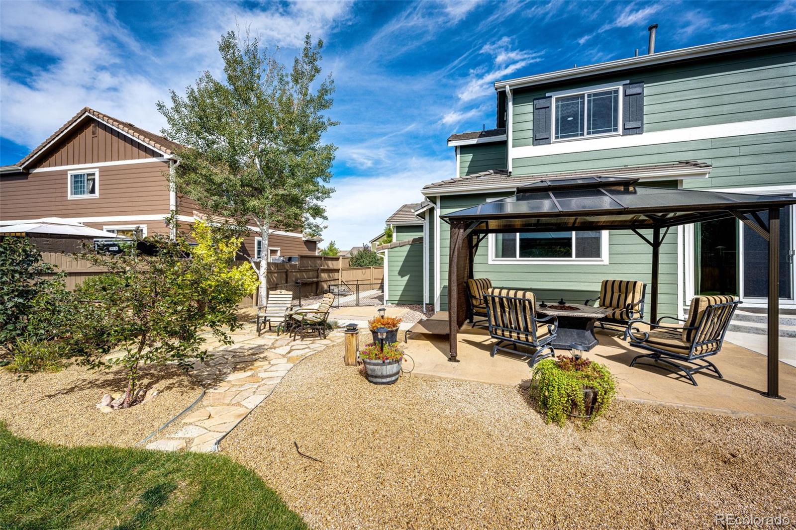 645 Springvale Road Castle Rock, CO 80104 - Photo 29 of 41 a view of the house with outdoor seating
