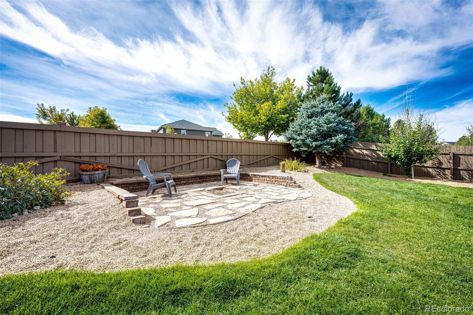 645 Springvale Road Castle Rock, CO 80104 - Photo 34 of 41 a view of a backyard with sitting area