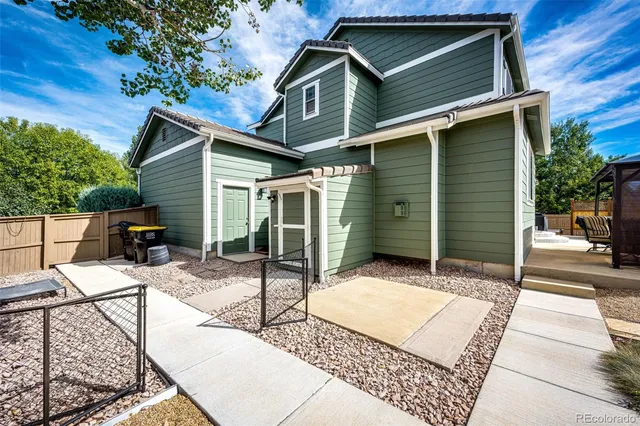 a backyard of a house with seating space