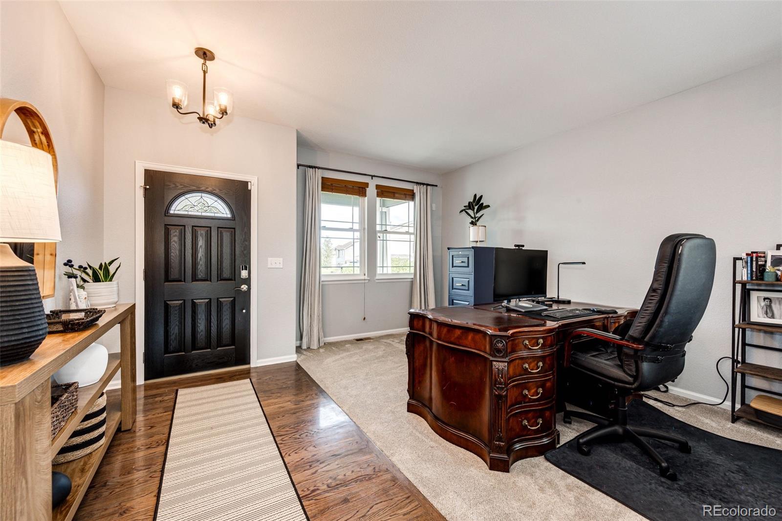 645 Springvale Road Castle Rock, CO 80104 - Photo 6 of 41 a view of a workspace with furniture and windows