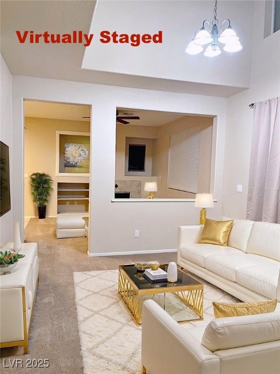7640 Sierra Paseo Lane Las Vegas, NV 89128 - Photo 15 of 49 Carpeted living area featuring ceiling fan and a chandelier