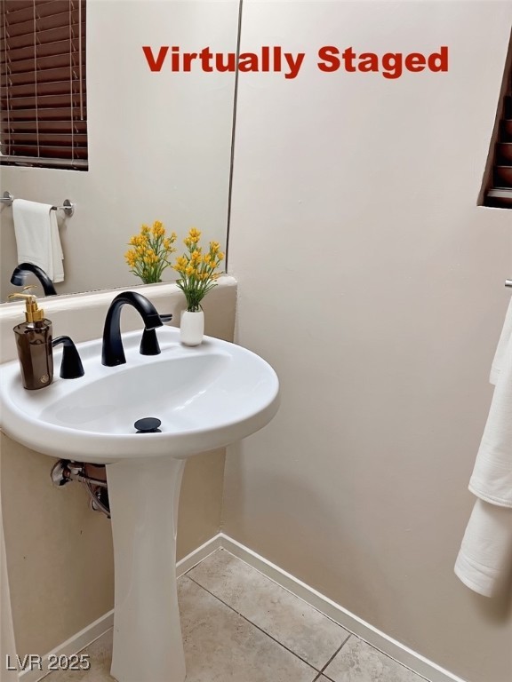 7640 Sierra Paseo Lane Las Vegas, NV 89128 - Photo 19 of 49 Bathroom with light tile patterned floors and baseboards