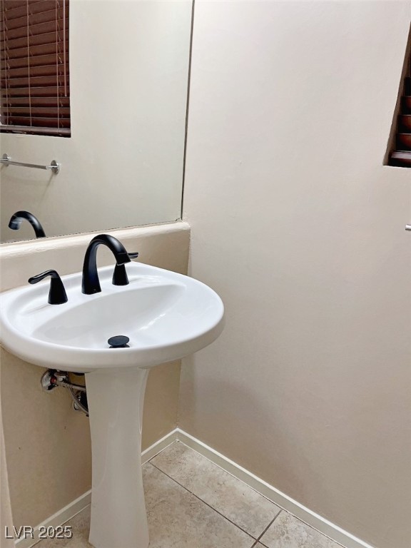 7640 Sierra Paseo Lane Las Vegas, NV 89128 - Photo 20 of 49 Bathroom with light tile patterned flooring and baseboards