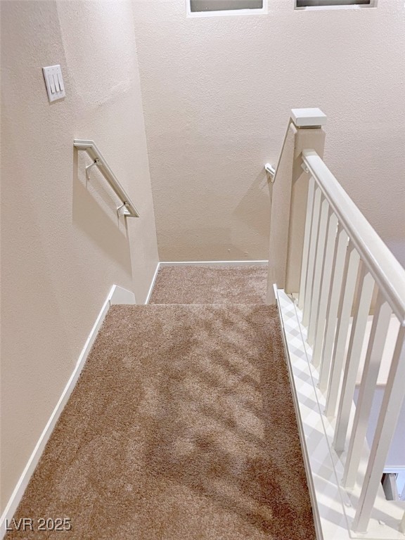 7640 Sierra Paseo Lane Las Vegas, NV 89128 - Photo 27 of 49 Staircase with carpet floors and a textured wall