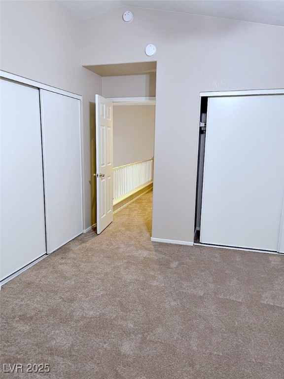 7640 Sierra Paseo Lane Las Vegas, NV 89128 - Photo 32 of 49 Unfurnished bedroom featuring two closets and light carpet