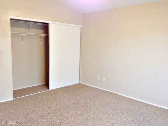 7640 Sierra Paseo Lane Las Vegas, NV 89128 - Photo 37 of 49 Unfurnished bedroom with a closet, carpet floors, and lofted ceiling