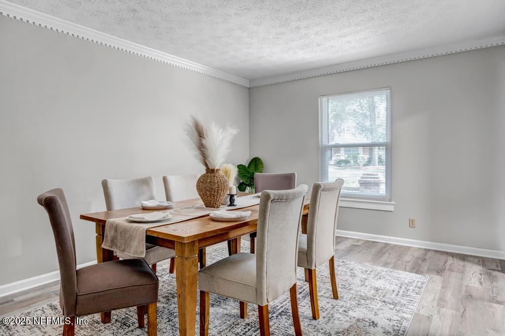 4448 Charter Point Boulevard Jacksonville, FL 32277 - Photo 12 of 47 a view of a dining room with furniture and window