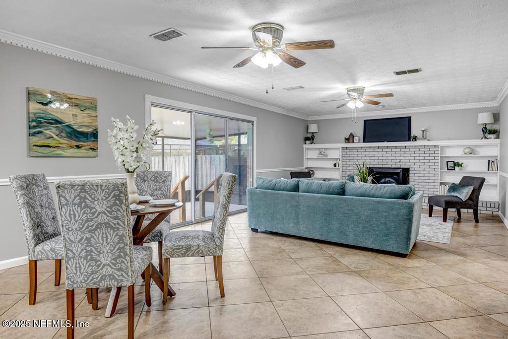 4448 Charter Point Boulevard Jacksonville, FL 32277 - Photo 18 of 47 a living room with furniture and a large window