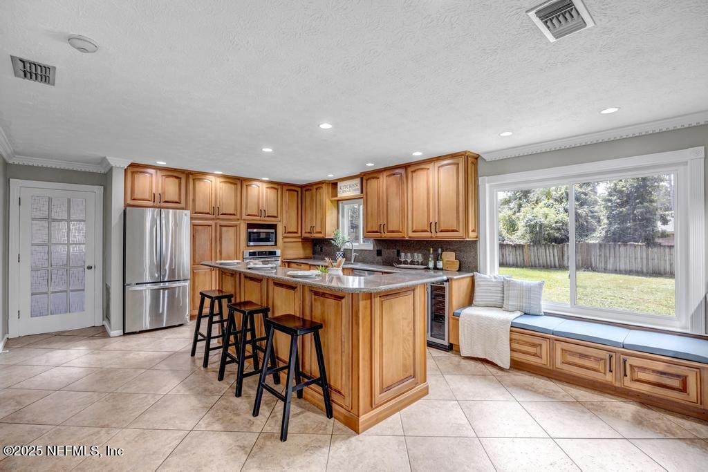 4448 Charter Point Boulevard Jacksonville, FL 32277 - Photo 21 of 47 a kitchen with a sink and chairs