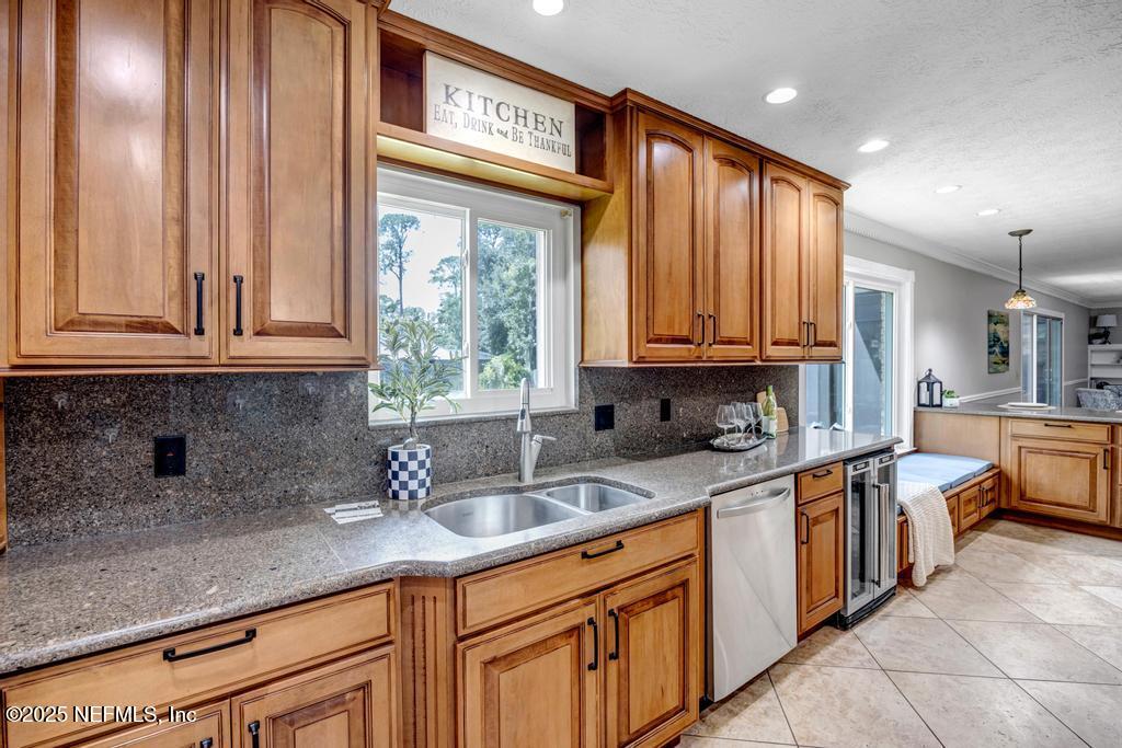 4448 Charter Point Boulevard Jacksonville, FL 32277 - Photo 24 of 47 a kitchen with stainless steel appliances granite countertop a sink stove and cabinets