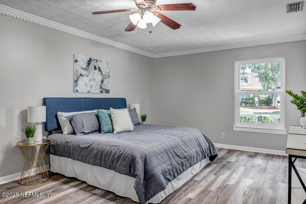 4448 Charter Point Boulevard Jacksonville, FL 32277 - Photo 26 of 47 a bedroom with a large bed and a window