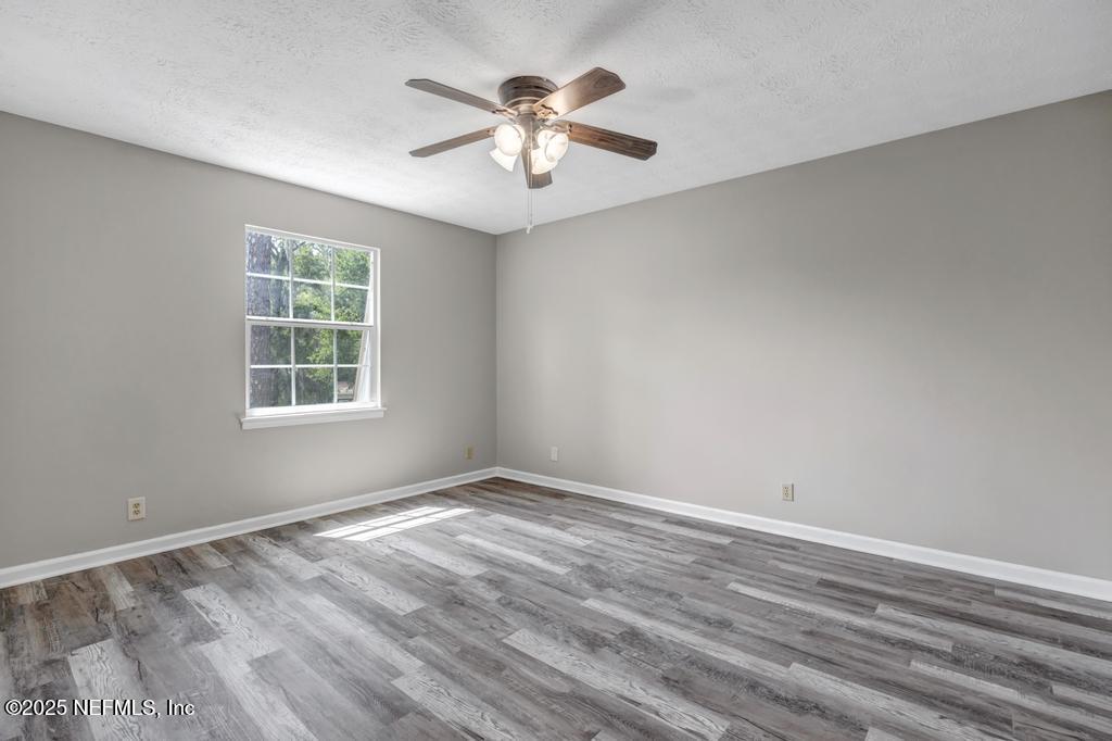 4448 Charter Point Boulevard Jacksonville, FL 32277 - Photo 36 of 47 wooden floor in an empty room with a window