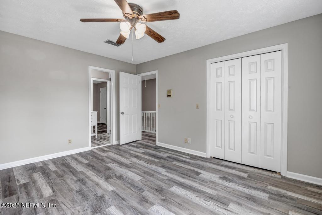 4448 Charter Point Boulevard Jacksonville, FL 32277 - Photo 37 of 47 an empty room with closet and a ceiling fan