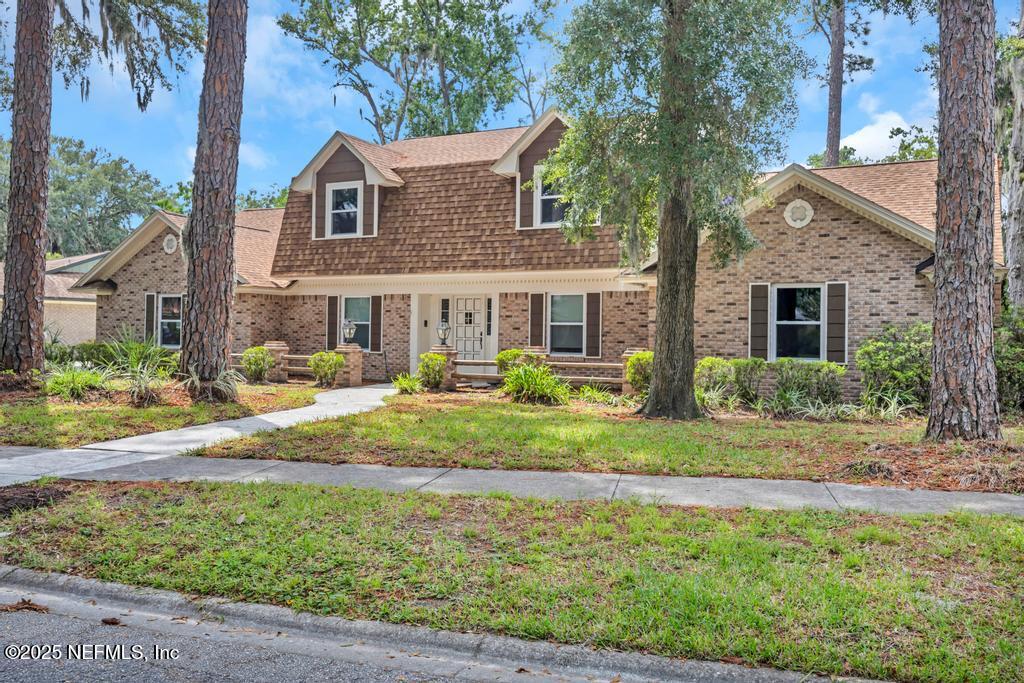 4448 Charter Point Boulevard Jacksonville, FL 32277 - Photo 4 of 47 a front view of a house with a yard
