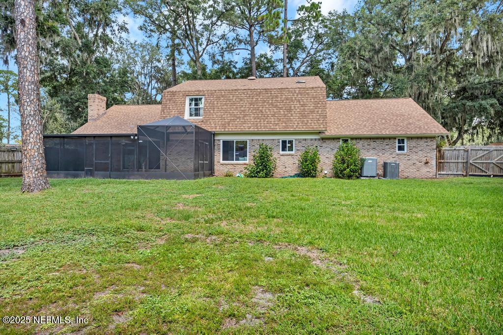 4448 Charter Point Boulevard Jacksonville, FL 32277 - Photo 44 of 47 a house view with a garden space