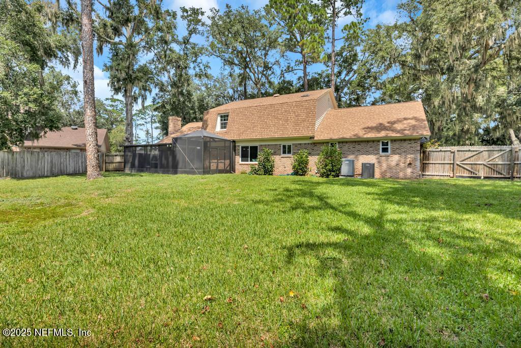 4448 Charter Point Boulevard Jacksonville, FL 32277 - Photo 46 of 47 a view of a house with a yard and sitting area