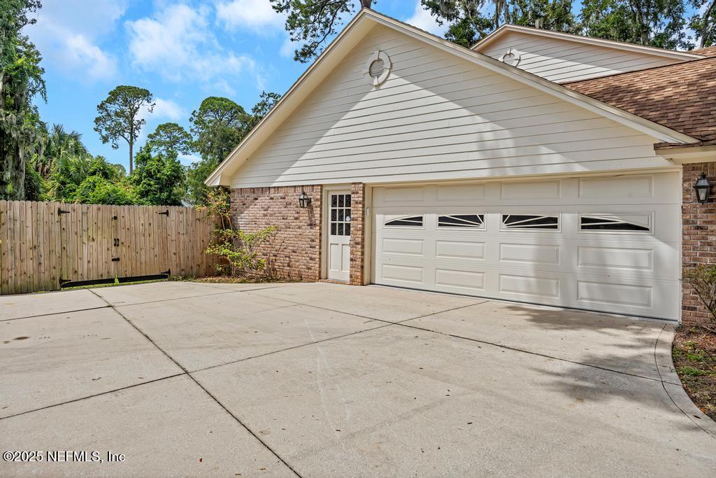 4448 Charter Point Boulevard Jacksonville, FL 32277 - Photo 5 of 47 a view of a house with a garage