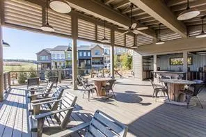a view of a dining room with furniture wooden floor and chandelier