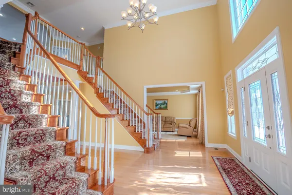 a bathroom with a sink a mirror and a window