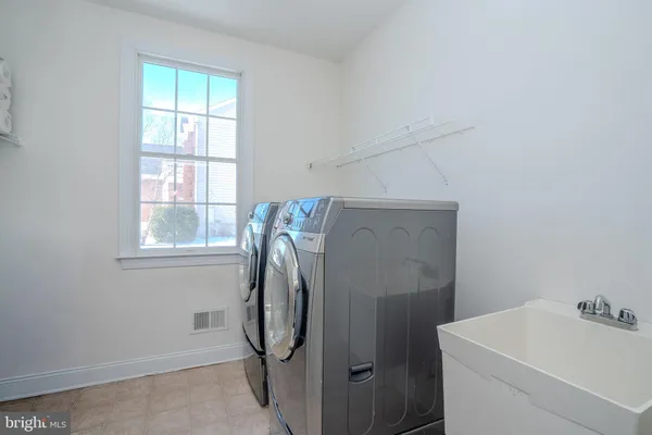 a living room with furniture and window