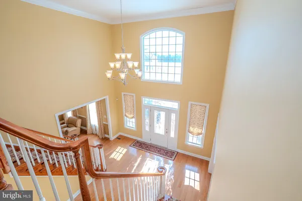 a bedroom with a bed and lamps on dresser