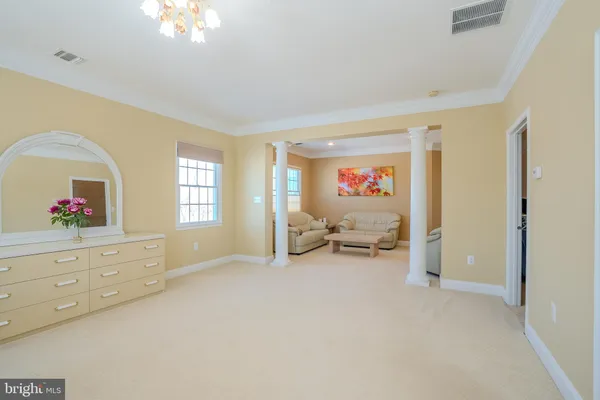 a view of a work space with wooden floor and furniture