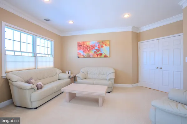 a bathroom with a sink vanity mirror and toilet