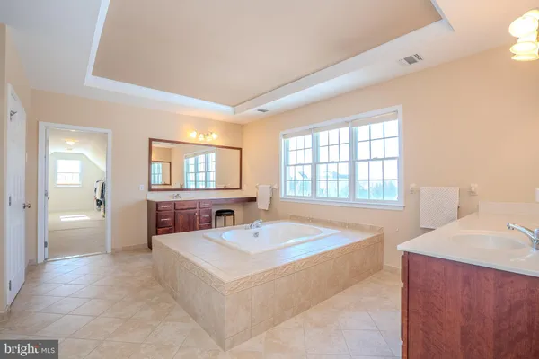 an aerial view of a house with outdoor space