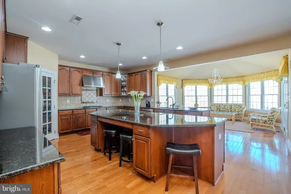 a kitchen with granite countertop cabinets and window