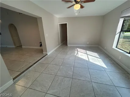 a view of an empty room with a window