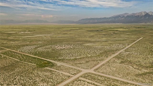 a view of a terrace with a building in the background