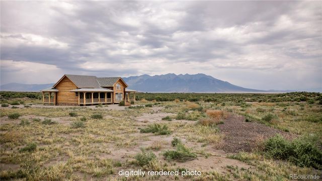 a view of a big house with a big yard and large tree