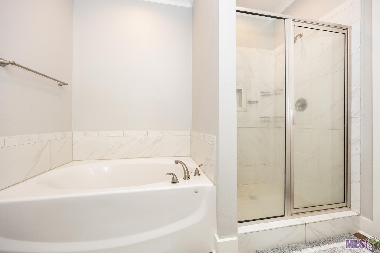 9016 Stonecroft Avenue Baton Rouge, LA 70810 - Photo 24 of 28 master bath soaking tub and tiled shower