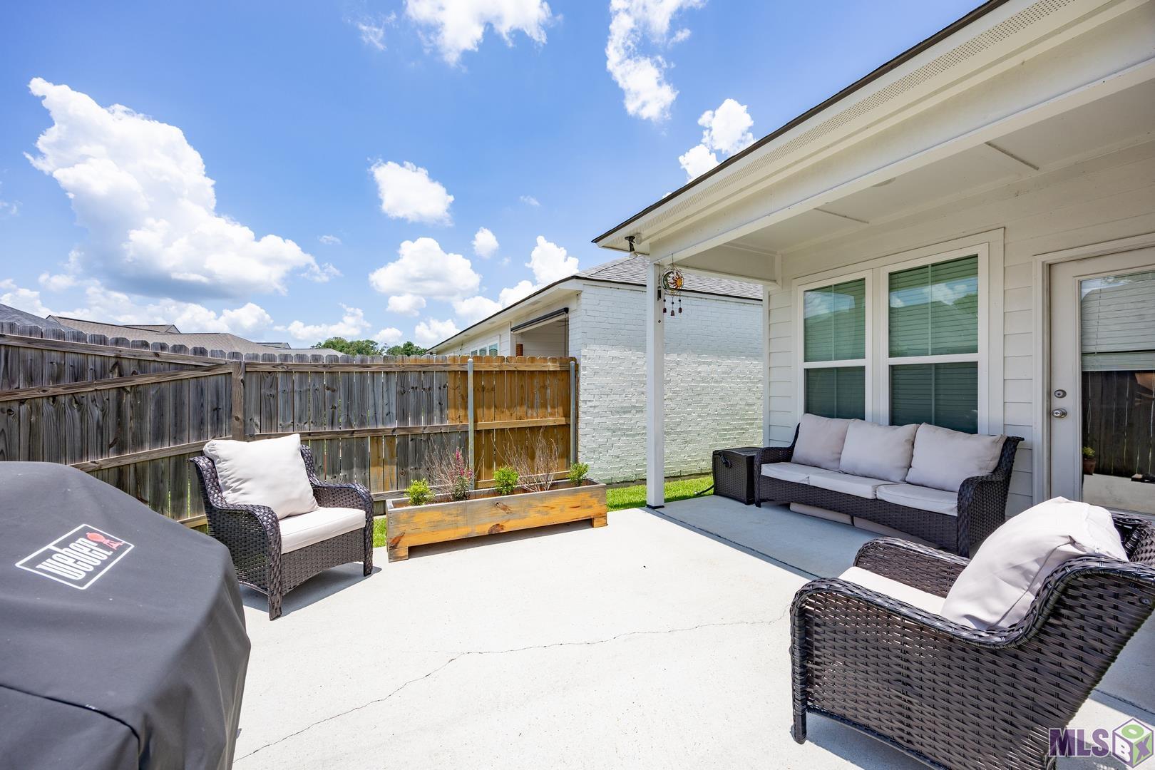 9016 Stonecroft Avenue Baton Rouge, LA 70810 - Photo 4 of 28 extended patio area