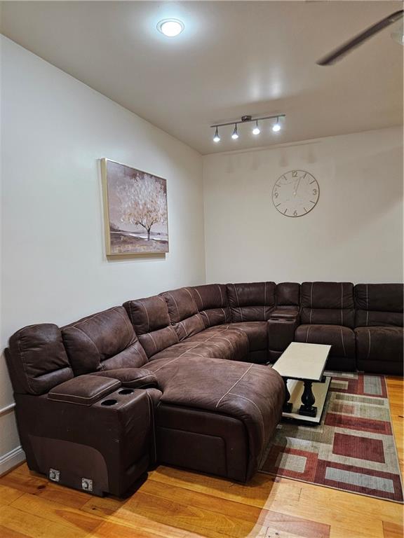 312 Forbes Avenue, Unit 2 Pittsburgh, PA 15222 - Photo 4 of 15 a living room with furniture and wooden floor