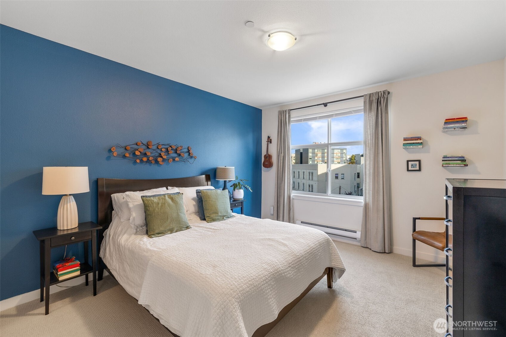 5440 Leary Avenue Northwest, Unit 617 Seattle, WA 98107 - Photo 13 of 28 a bedroom with a bed and a lamp