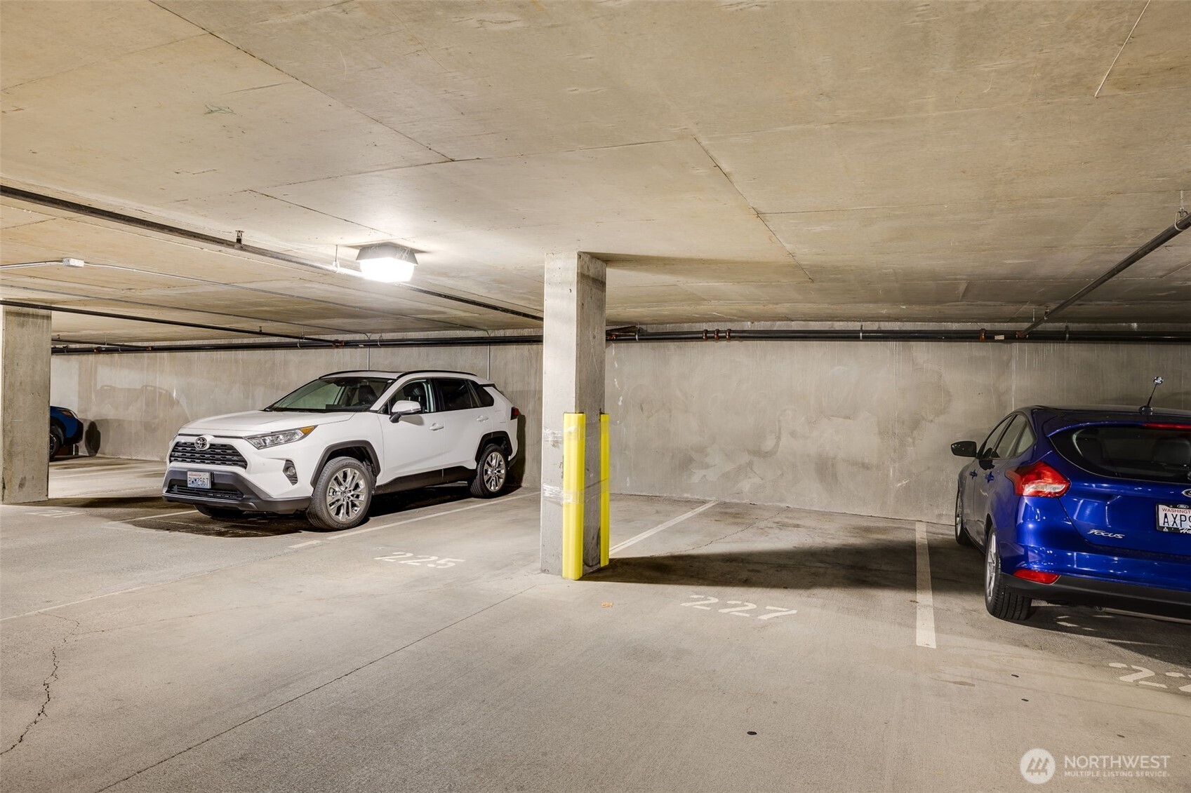 5440 Leary Avenue Northwest, Unit 617 Seattle, WA 98107 - Photo 26 of 28 a view of parking garage with cars